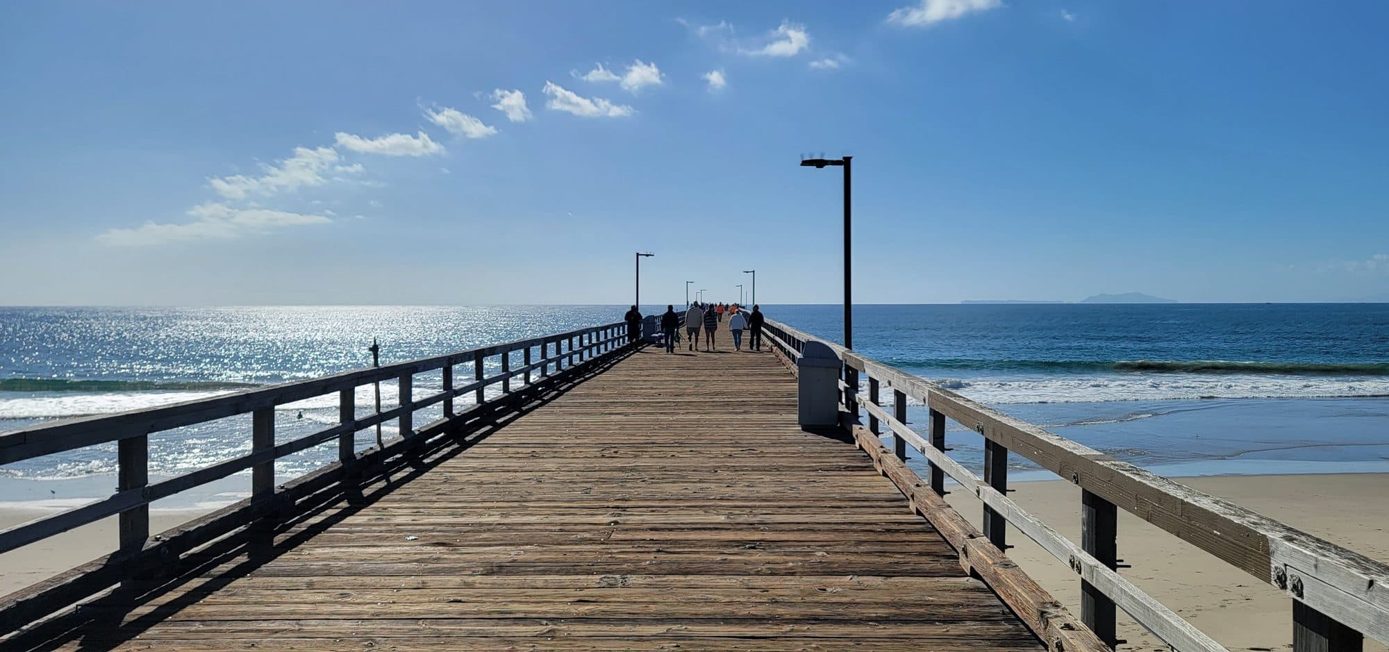The Port Hueneme Pier stretching over the Pacific, with Anacapa Island on the horizon